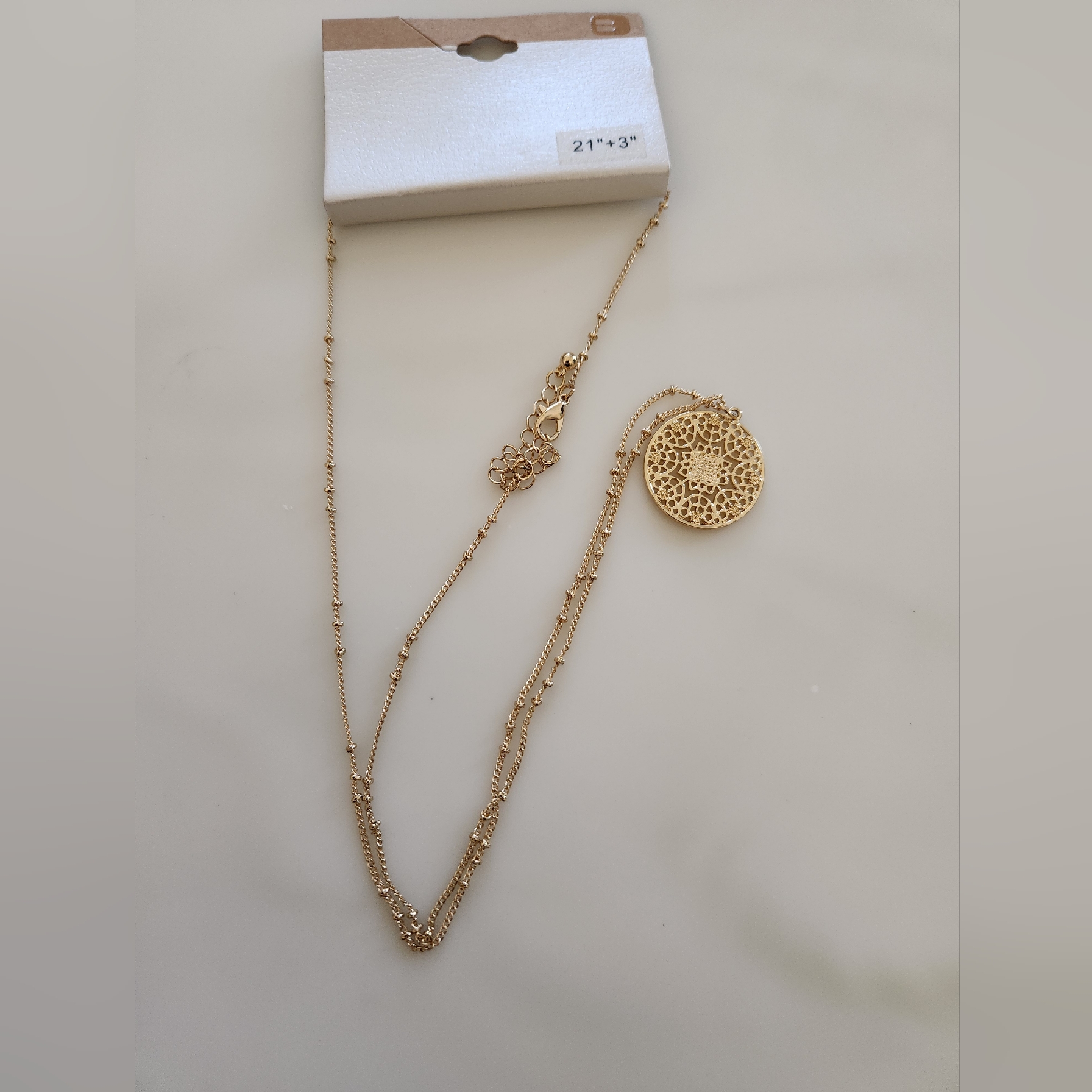 Buckle Gold Tone Necklace With A Gold Circle Pendant